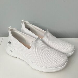 Women’s white Skechers GoWalk slip-on shoes